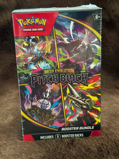 A sealed Pokémon Trading Card Game booster box for Mega Evolution Pitch Black, photographed standing upright on a brown textured surface. The box art is highly colorful with black, red, yellow, blue, and white elements, and the Pokémon logo is clearly visible at the top left.